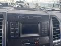 Interior dashboard controls of a 2017 Ford F-550 featuring a touchscreen display and various buttons for audio and media functions