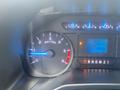 Close-up of the dashboard of a 2017 Ford F-550 showing the RPM gauge with a blue indicator and a digital odometer displaying 56269 km