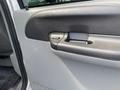 Close-up of the door handle of a 2007 Ford F-350 SD showcasing a simple black design with a rectangular shape