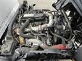 Engine of a 2018 Hino 195 with various pipes and components visible showcasing the turbocharger and other mechanical parts