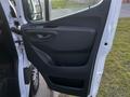 A 2019 Mercedes-Benz Sprinter side door with a sleek design featuring a handle and window controls