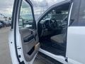 2017 Ford F-550 with an open driver side door showing the interior including steering wheel and seat