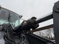 Close-up of a hydraulic arm and cylinder from a 2018 Doosan DL300-5 wheel loader with visible hoses and attachments