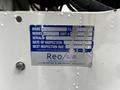 A blue inspection sticker attached to a white surface displaying information about a 2008 International 7500 truck including make model and inspection dates