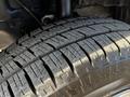 Close-up of a tire on a 2017 Ford Transit showing deep tread patterns designed for traction and durability