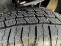 Close-up of a 2023 Toyota Tundra tire showcasing its tread pattern with deep grooves and textured surface