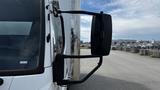 A 2018 Mitsubishi Fuso FE truck showcasing its side mirror and portion of the cab