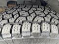 Close-up of the tread pattern on a tire from a 2012 GMC Savana showing deep grooves and rugged design for traction