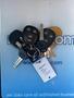 A set of keys with four key fobs including a 2012 Chevrolet Express fob and a tag labeled C179510