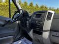 Interior of a 2017 Mercedes-Benz Sprinter showing the dashboard controls steering wheel and seating area