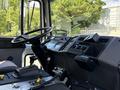 Interior view of a 1994 Volvo FE 42 featuring a steering wheel dashboard controls gear shift and various gauges