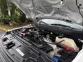 The engine compartment of a 2018 Ford F-550 showcasing the engine components and various fluids in their respective reservoirs