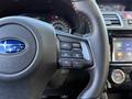 Close-up of a 2021 Subaru WRX steering wheel with control buttons for cruise control and audio settings