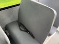Gray bench seat with a seatbelt in a 2022 Freightliner B2