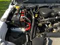 Close-up of the engine bay of a 2016 Ford F-550 showcasing the battery and various components like hoses and connectors