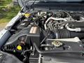 A 2015 Ford F-550 engine bay showing various components including the air intake system battery and radiator cap