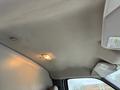 Interior view of a 2009 Chevrolet Express showing the ceiling with a light and a sun visor