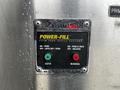Control panel for a Foam Pro Power-Fill system with green and red buttons labeled Auto and Manual
