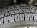 Close-up of a tire tread from a 2018 Ford Transit showing deep grooves and patterns indicating tire wear and traction features
