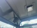 Interior view of a 2024 AGT Industrial H13R Mini Excavator showing the ceiling and light fixture