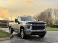 A 2023 Chevrolet Silverado 3500HD parked with chrome accents and a bold front grille showcasing its powerful design and robust build