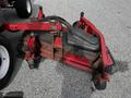 2012 Toro Groundsmaster lawn mower attachment with a red frame and black components designed for grass cutting and maintenance