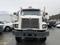 A white 2003 International 5600i truck with a prominent grille and front headlights visible