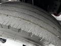 Close-up of a worn tire from a 2018 Isuzu NPR showing visible tread wear and signs of dirt accumulation on the surface