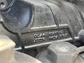 Close-up of a 2022 Freightliner Cascadia engine component showing detailed casting marks and part numbers