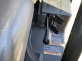 Close-up of the gear shift lever and control panel of a 2018 Kubota RTV-X 1100 C showcasing its operational features