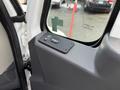 Interior view of a 2013 International Durastar 4300 showing the control panel with buttons for door operation and window controls