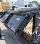 A 2024 Southland SL716-20K trailer with a hinged gate is being operated by a person wearing a black shirt