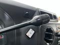 A close-up of the control stalk of a 2011 Ford Econoline indicating the on and off settings