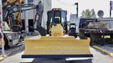 A yellow 2013 Komatsu D37PX-22 bulldozer with a large front blade facing forward