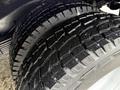 Close-up of a rugged tire tread on a 2008 Chevrolet Express showcasing deep grooves and patterns for enhanced traction