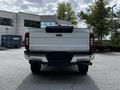 A 2020 Ford F-350 Super Duty viewed from the rear displaying its tailgate with the words SUPER DUTY prominently featured