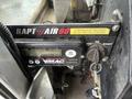 Control panel for a VMAC air compressor with a digital display and a key ignition switch labeled RAPT AIR 60 ready indicator and warning message