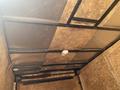 Interior view of a 2020 Stealth Enterprises Trailer showing a ceiling with metal framing and panels made of wood-like material