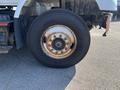 A close-up of a tire on a 2007 International 7300 showing rust on the rim and visible tread on the tire