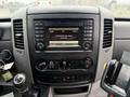Dashboard of a 2016 Mercedes-Benz Sprinter showing the center console with audio and media controls