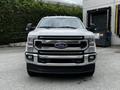 A 2020 Ford F-350 Super Duty truck is shown from the front with a chrome grille and Ford emblem prominently displayed