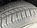 Close-up of a tire from a 2018 Ford F-150 showcasing the tread pattern and surface wear indicating usage