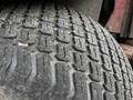Close-up of a rubber tire tread from a 2012 Toro Groundsmaster showing deep grooves and wear patterns