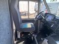 2012 Ford Econoline interior with driver's seat and steering wheel visible