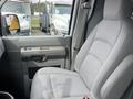 A gray cloth driver's seat from a 2009 Ford Econoline with a simple and ergonomic design
