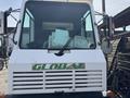 A 2015 Global Street Sweeper with a white exterior displaying the brand name "GLOBAL" in green across the front grille