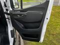 The image shows the interior door panel of a 2022 Mercedes-Benz Sprinter with a sleek design and a black finish