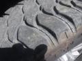 Close-up view of a tire on a 2018 Ford F-350 SD showcasing tread patterns with some wear and dirt