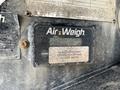 A close-up of an Air Weigh scale display attached to a trailer showing information and controls for weighing cargo