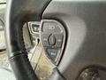 Close-up of the steering wheel controls of a 2018 Kenworth T800 featuring buttons for off reset set and on